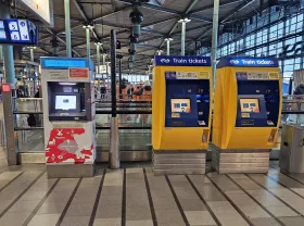 Ticket machines: yellow for train, white-red for bus/train/metro